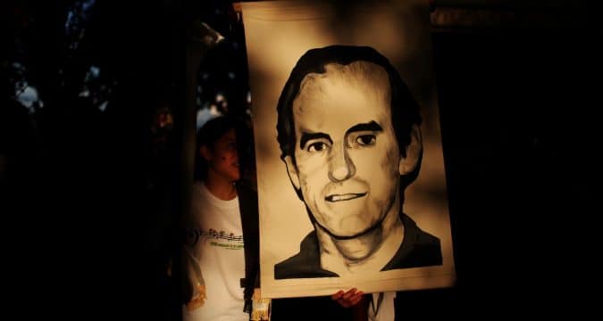 El Salvador charges former president with 1989 murders 